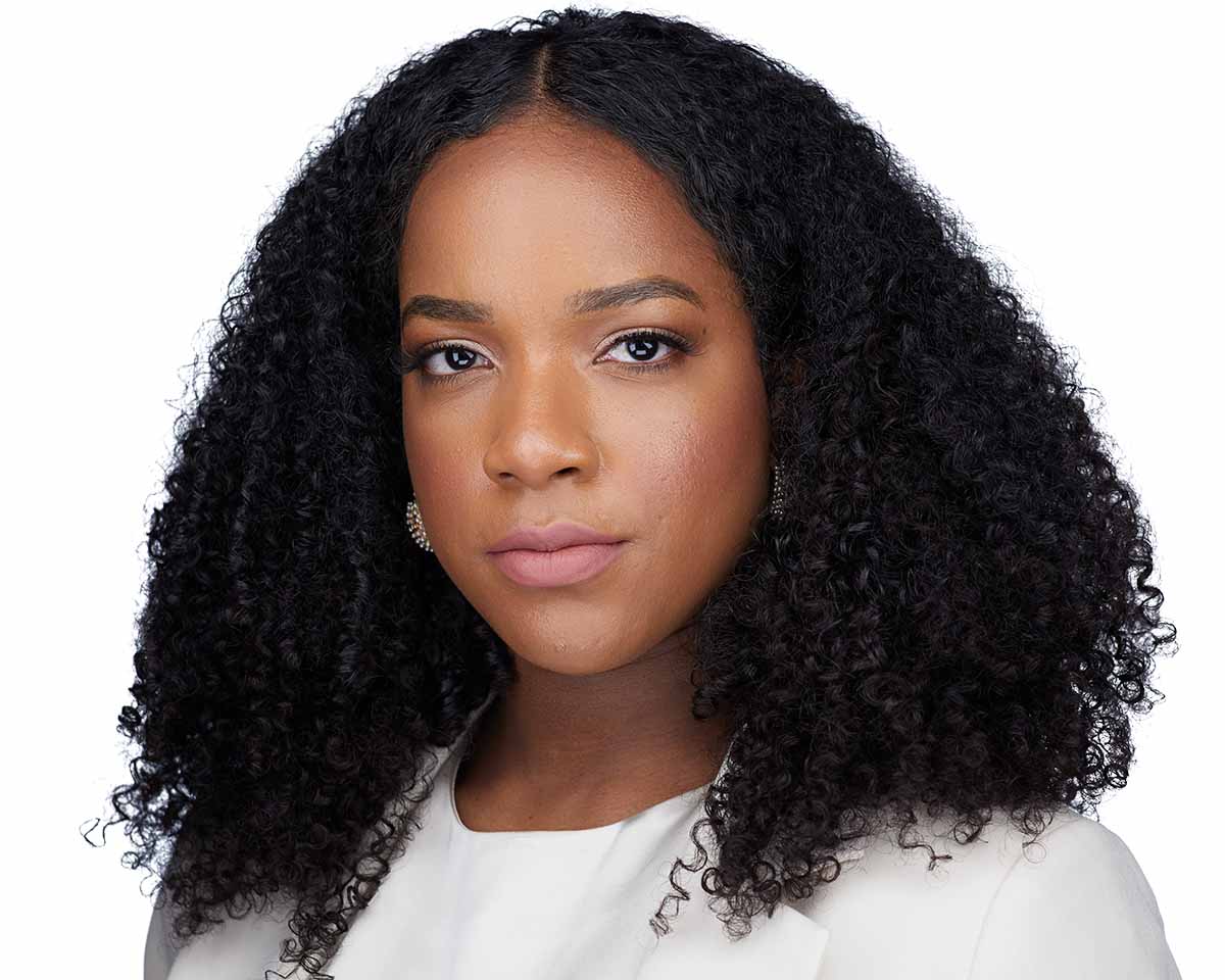 Black Female Executive Headshot with a white jacket in Alexandria Virginia