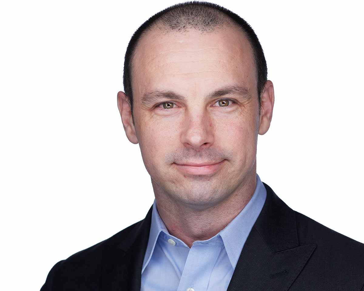 Young Male Professional Headshot with a dark blue jacket and a light blue shirt in Alexandria Virginia