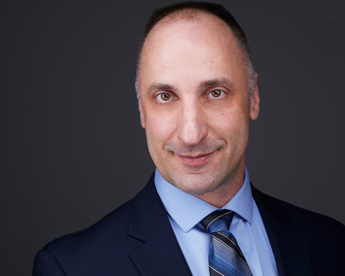 Male CEO Professional Headshot with a blue jacket and blue shirt in Alexandria Virginia