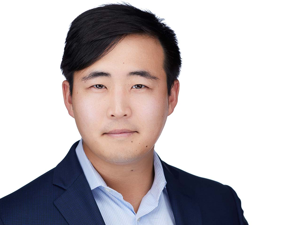 Asian male Executive Headshot with a white jacket in Alexandria Virginia